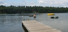Camper jumping off the dock